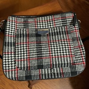 Black,red and white Plaid, crossbody purse. Many, many compartments! Like new!